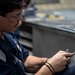 Aviation Structural Mechanic Files Launch Bar Placards in the Jet Shop Aboard USS Carl Vinson (CVN 70)