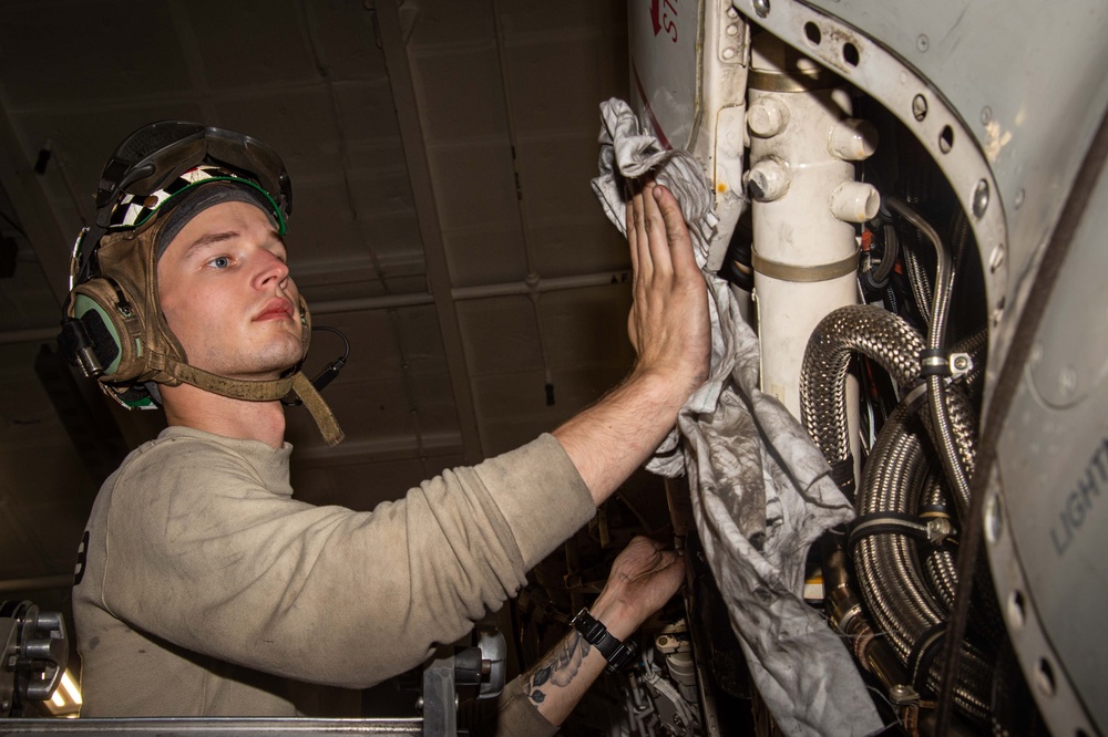 Aviation Machinist’s Mate Performs Preventative Maintenance on an E-2D Advance Hawkeye