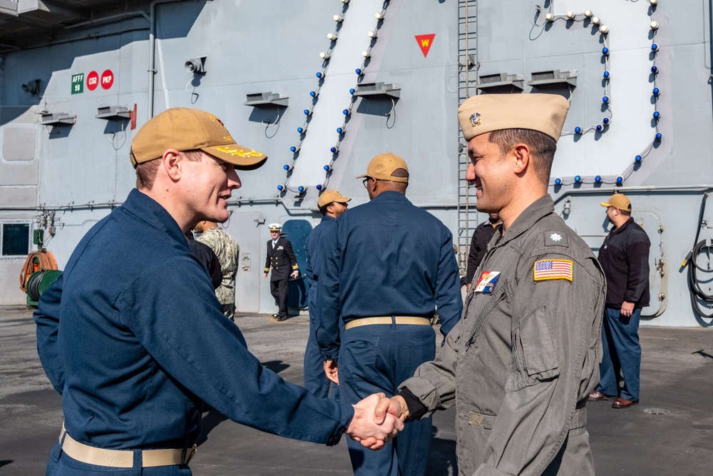 Commander, Task Force 70 (CTF 70) holds promotion ceremony