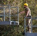 KFOR Swiss Army engineers construct a pedestrian bridge over the Ibar River