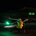 A Sailor Prepares to Launch a F-35C Lightning II aboard Nimitz-class aircraft carrier USS Carl Vinson (CVN 70)