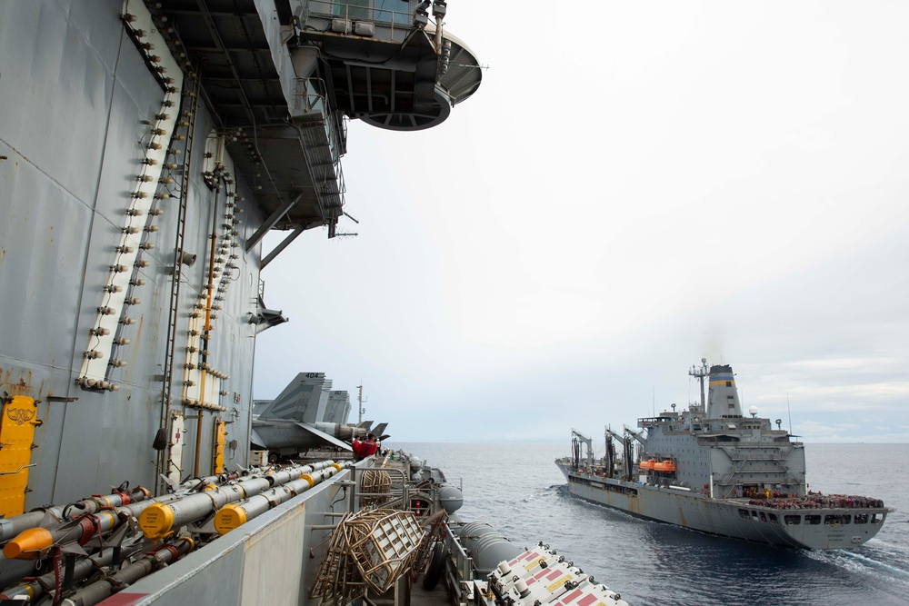 Abraham Lincoln conducts a replenishment-at-sea with USNS Rappahannock