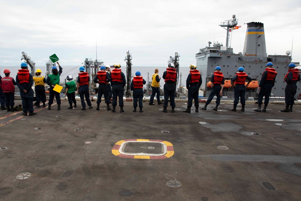 Abraham Lincoln conducts a replenishment-at-sea with USNS Rappahannock