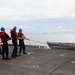 Abraham Lincoln conducts a replenishment-at-sea with USNS Rappahannock