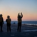 Sailors and Coast Guardsman medically evacuate a Sailor