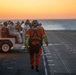 Sailors and Coast Guardsman medically evacuate a Sailor