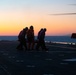 Sailors and Coast Guardsman medically evacuate a Sailor