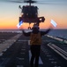 Sailors and Coast Guardsman medically evacuate a Sailor