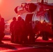 Sailors and Coast Guardsman medically evacuate a Sailor