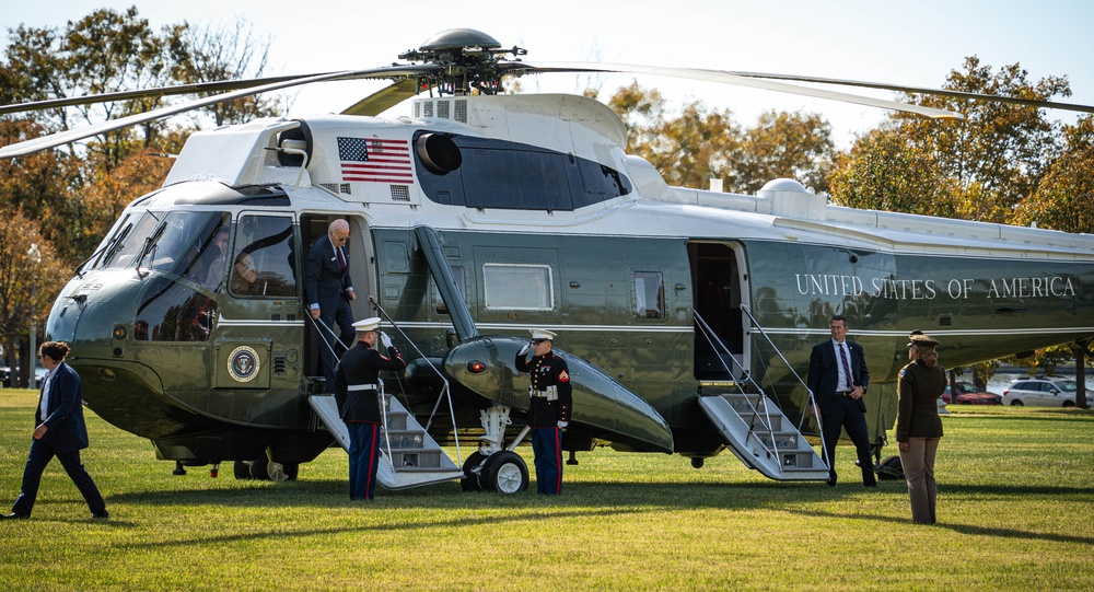 President Joe Biden lands at Fort McNair