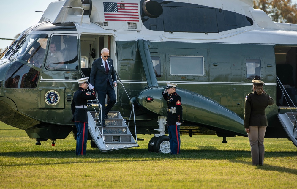 President Joe Biden lands at Fort McNair