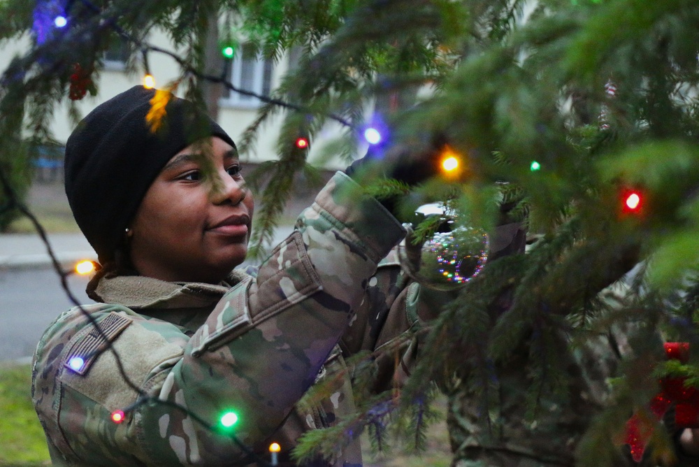 Forward Stationed Soldiers in Bemowo Piskie, Poland, decorate the base Christmas tree in celebration of the Holidays December 2, 2024