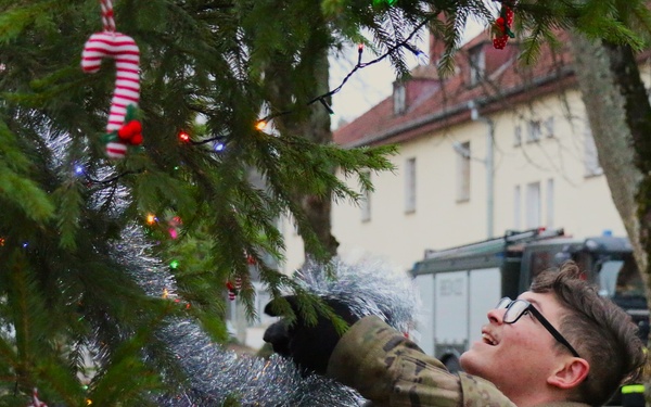 Forward Stationed Soldiers in Bemowo Piskie, Poland, decorate the base Christmas tree in celebration of the Holidays December 2, 2024