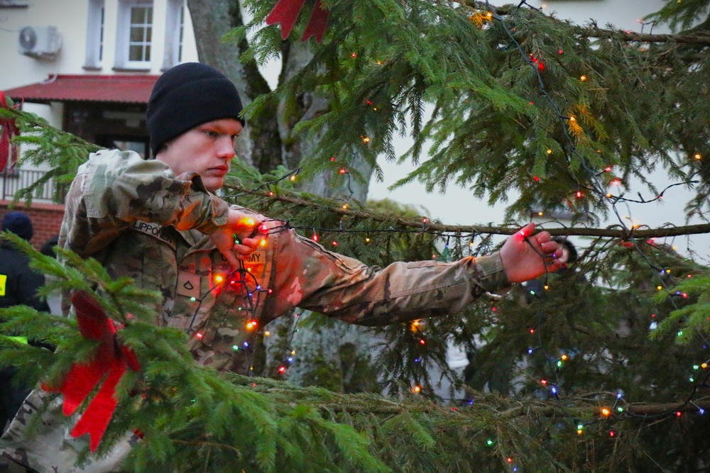 Forward Stationed Soldiers in Bemowo Piskie, Poland, decorate the base Christmas tree in celebration of the Holidays December 2, 2024