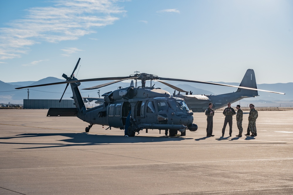 Members of the 58th Special Operations Wing prepare a HH-60G Pave Hawk helicopter for its final flight before retirement