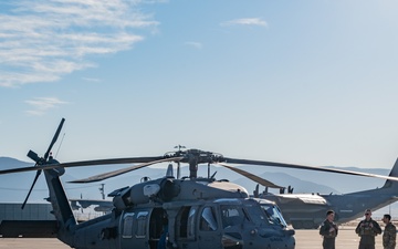 Members of the 58th Special Operations Wing prepare a HH-60G Pave Hawk helicopter for its final flight before retirement