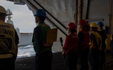 Abraham Lincoln conducts a replenishment-at-sea with Cesar Chavez