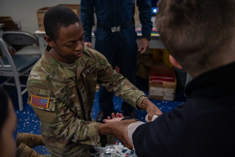 U.S. Army Soldiers assist with TCCC Training Aboard USS Ronald Reagan (CVN76)