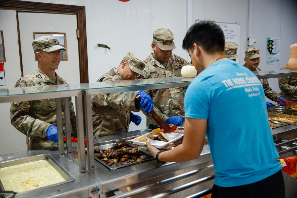 17th Sustainment Brigade command team serve Thanksgiving dinner to Soldiers