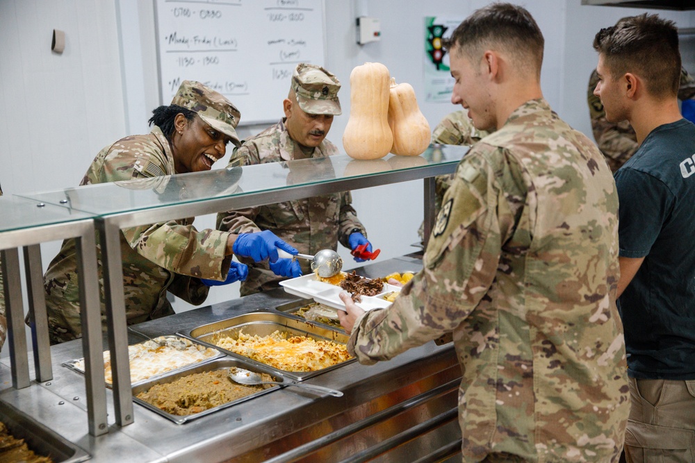 17th Sustainment Brigade command team serve Thanksgiving dinner to Soldiers