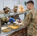 17th Sustainment Brigade command team serve Thanksgiving dinner to Soldiers