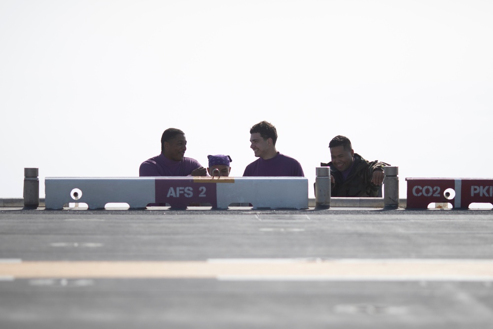 Sailors Perform a FOD Walkdown