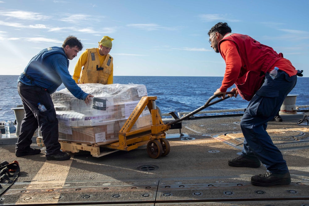 USS Spruance conducts a vertical replenishment with the USNS Caesar Chavez
