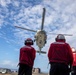 USS Spruance conducts a vertical replenishment with the USNS Caesar Chavez