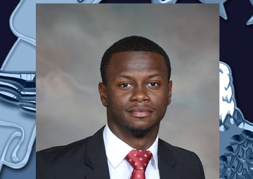 Contracting specialist, wrestling coach finds meaning in career, community