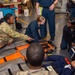 U.S. Army Soldiers assist with TCCC Training aboard USS Ronald Reagan (CVN76)