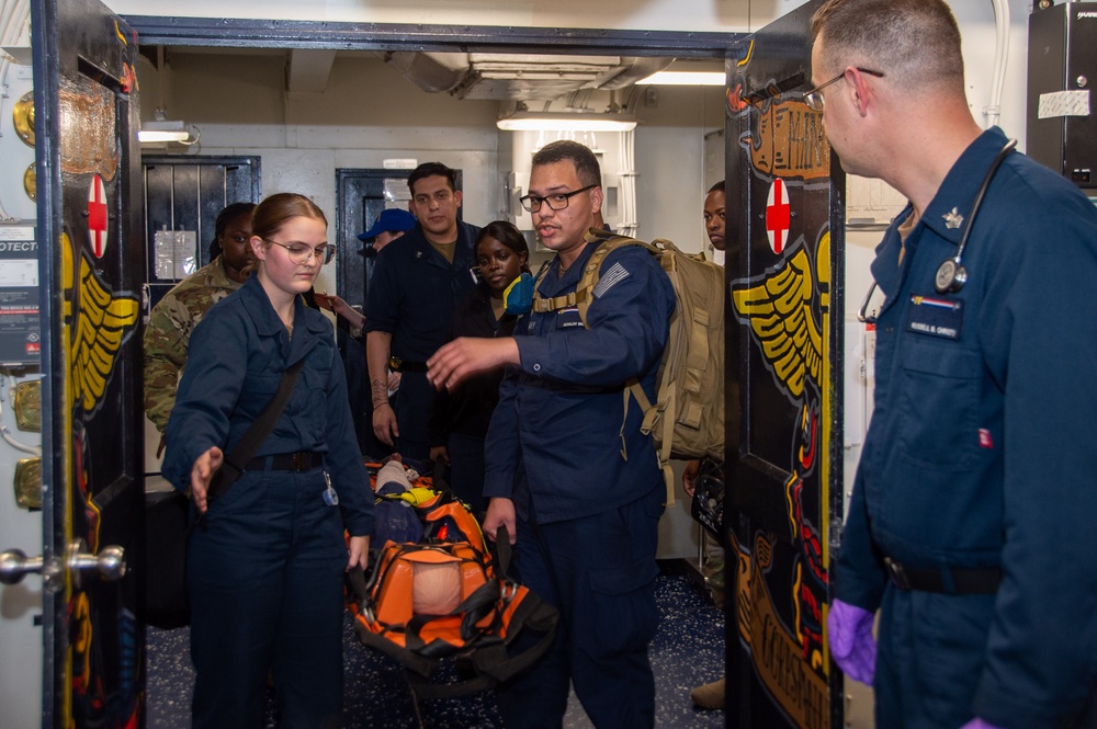 U.S. Army Soldiers assist with TCCC Training aboard USS Ronald Reagan (CVN76)