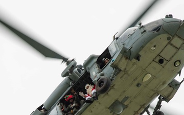 Santa flies over Naval Hospital Guam with HSC 25