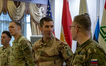 Coalition Forces Members Receive Coins