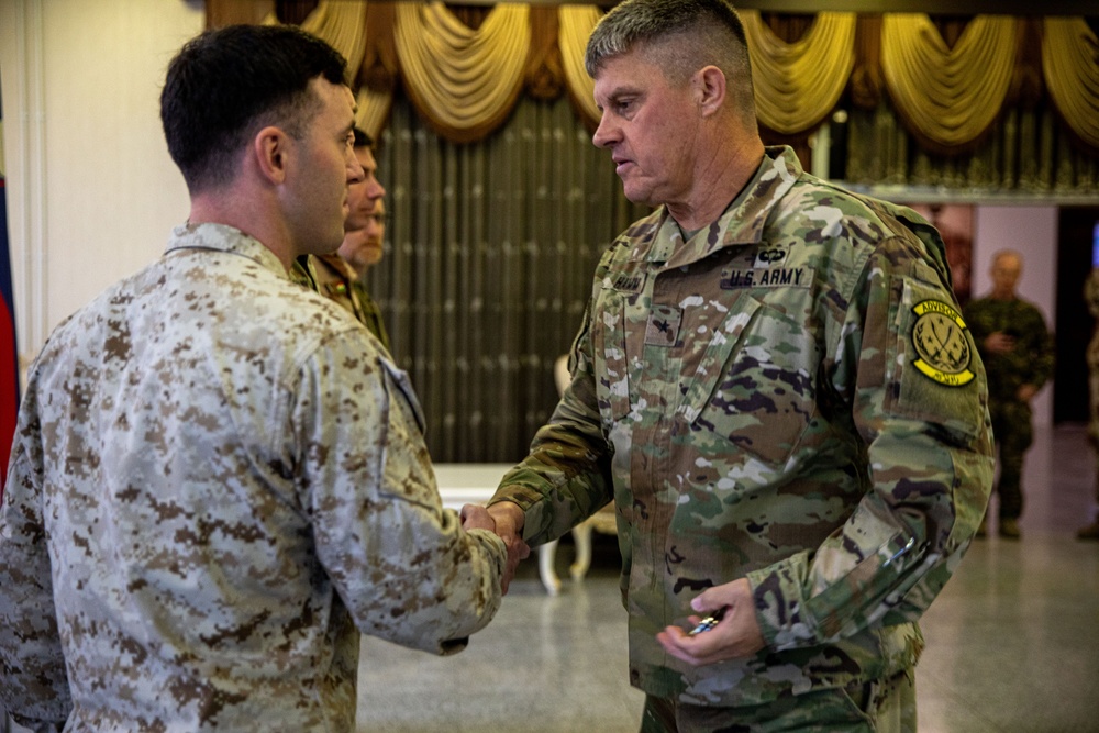 Coalition Forces Members Receive Coins