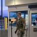 914th Security Forces Squadron Senior Airman checks identification cards at main gate