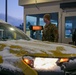 914th Security Forces Squadron Senior Airman checks identification cards at main gate