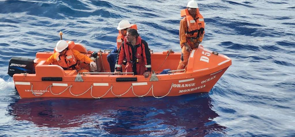 Coast Guard, tanker ship Orange Ocean rescue boater from vessel on fire sinking 420 miles north of Puerto Rico