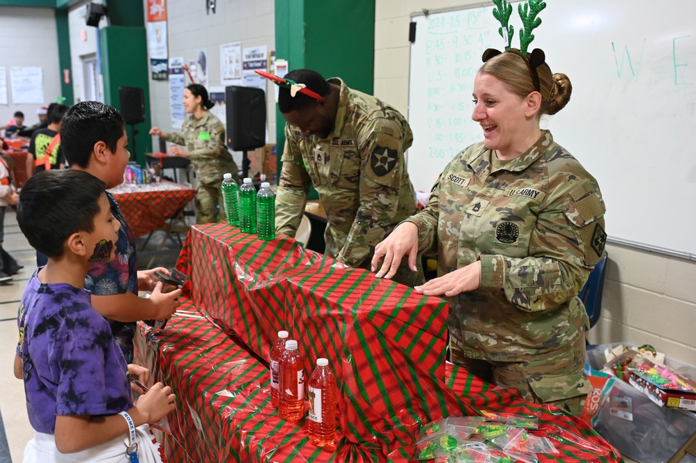 187th Medical Battalion spreads holiday cheer at Briscoe Elementary