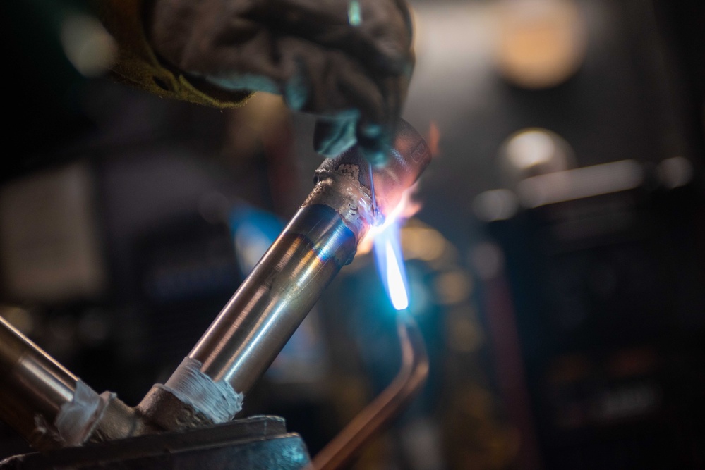 USS Ronald Reagan (CVN 76) Sailors practice welding