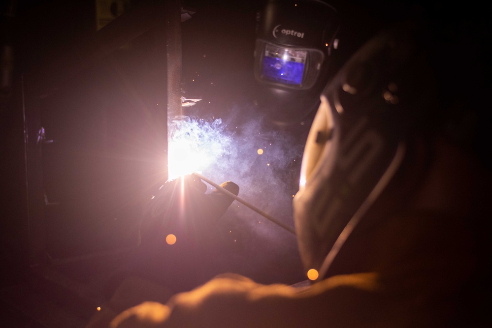 USS Ronald Reagan (CVN 76) Sailors practice welding