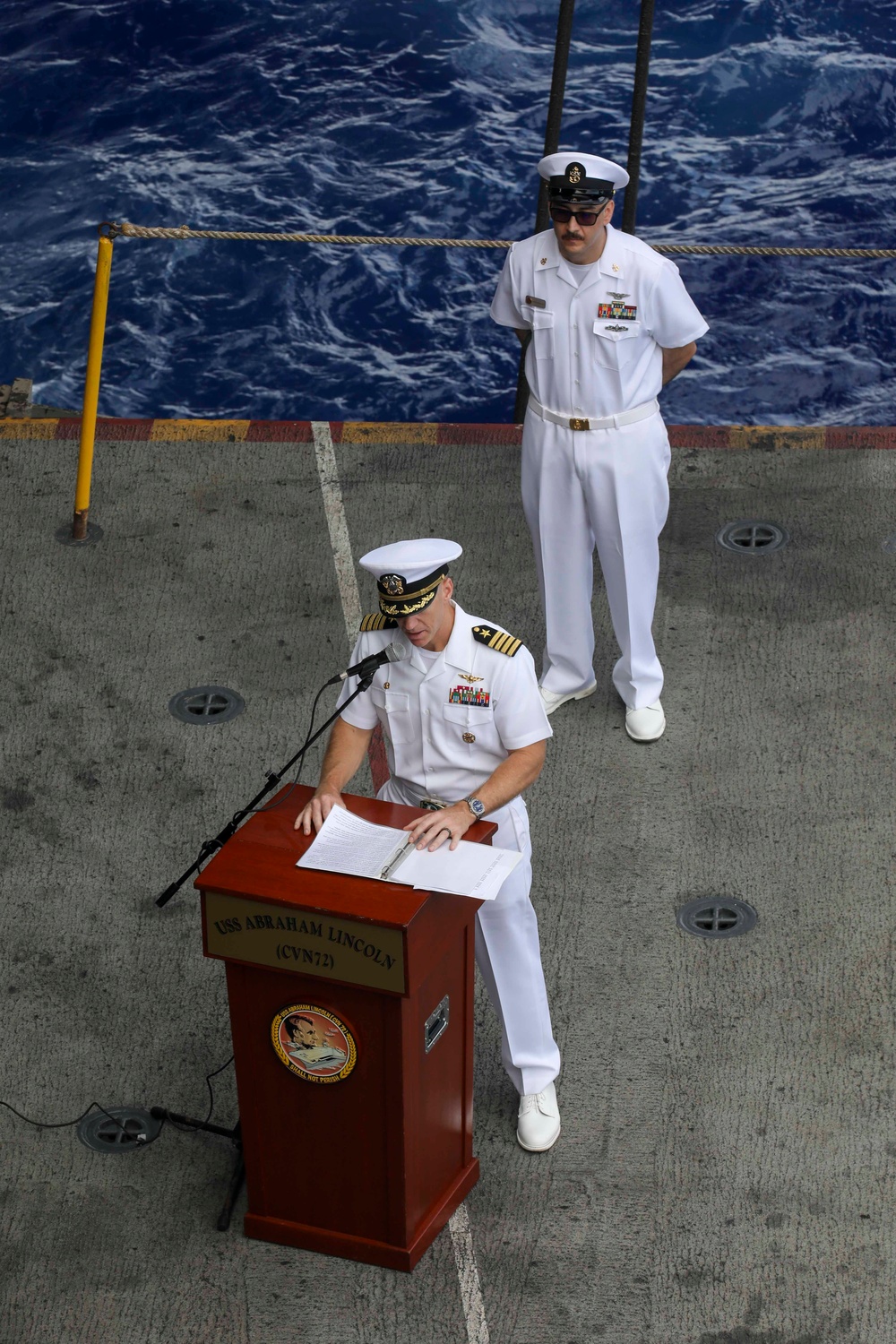 Abraham Lincoln conducts a Pearl Harbor remembrance ceremony