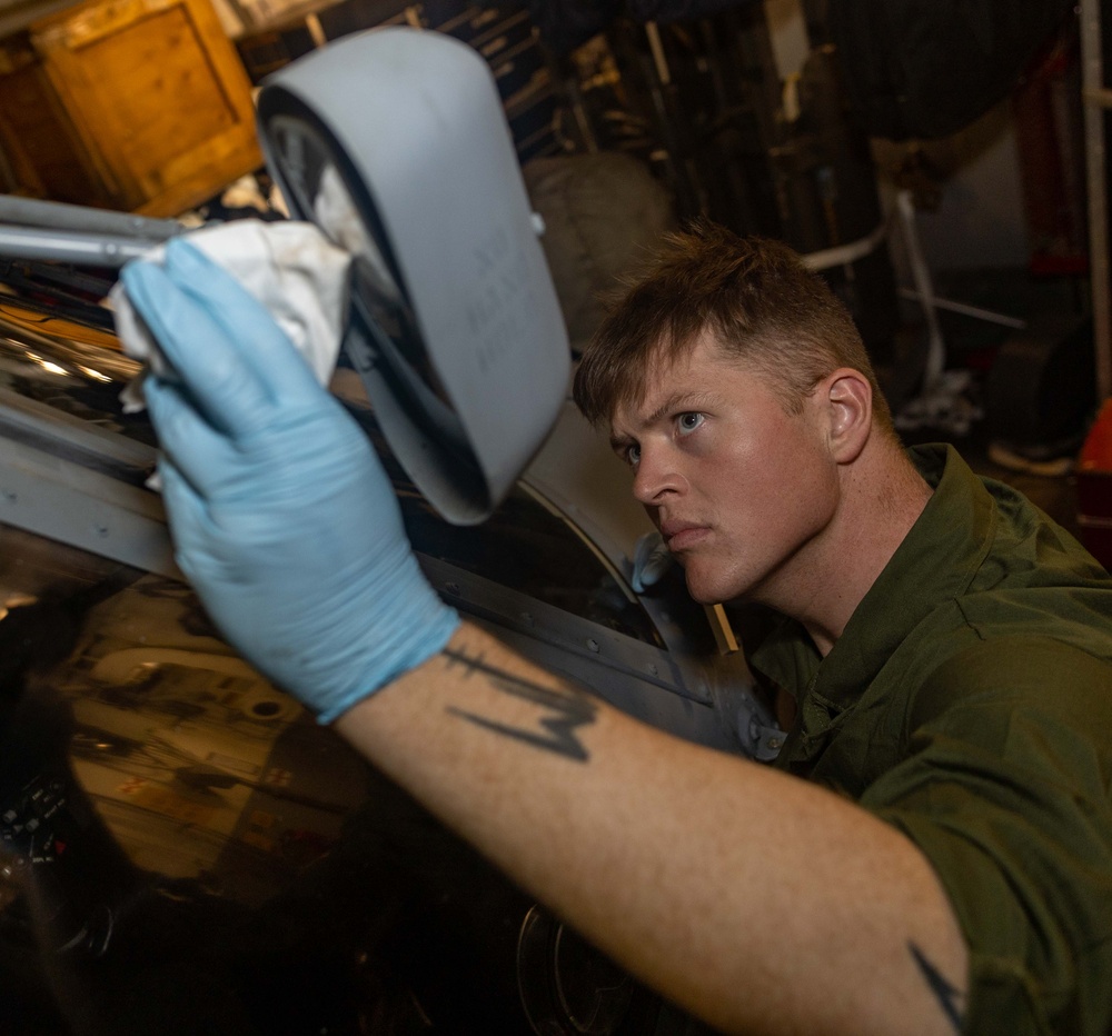 AM3 Harrison Morris Conducts Corrosion Control Maintenance On MH-60R Sea Hawk