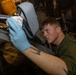AM3 Harrison Morris Conducts Corrosion Control Maintenance On MH-60R Sea Hawk