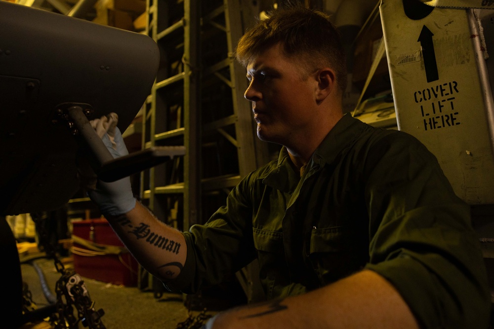 AM3 Harrison Morris Conducts Corrosion Control Maintenance on MH-60R Sea Hawk