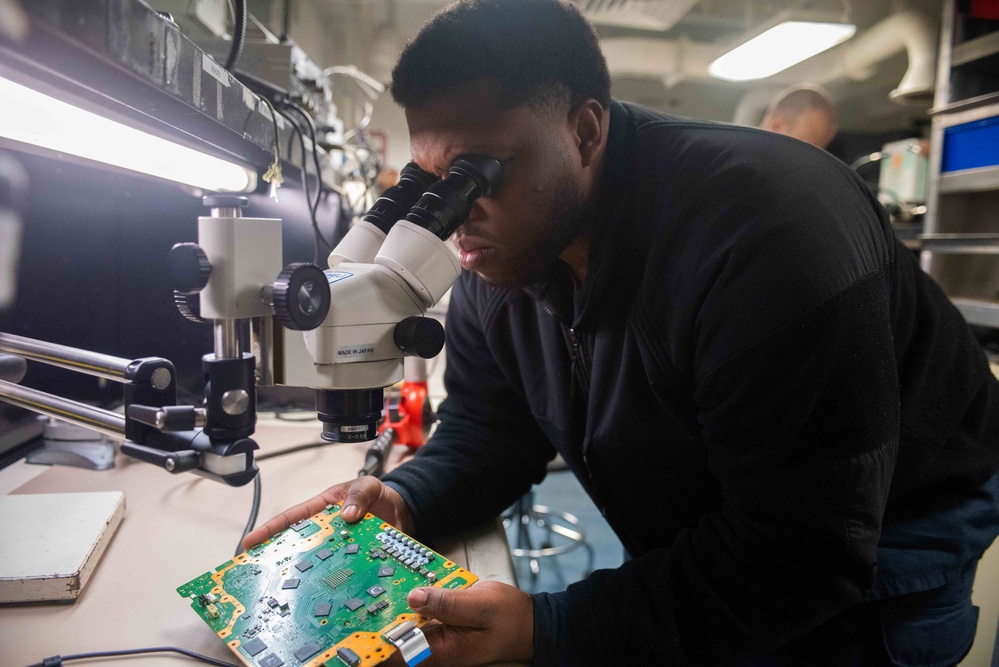 USS Ronald Reagan (CVN 76) Sailors conduct soldering training