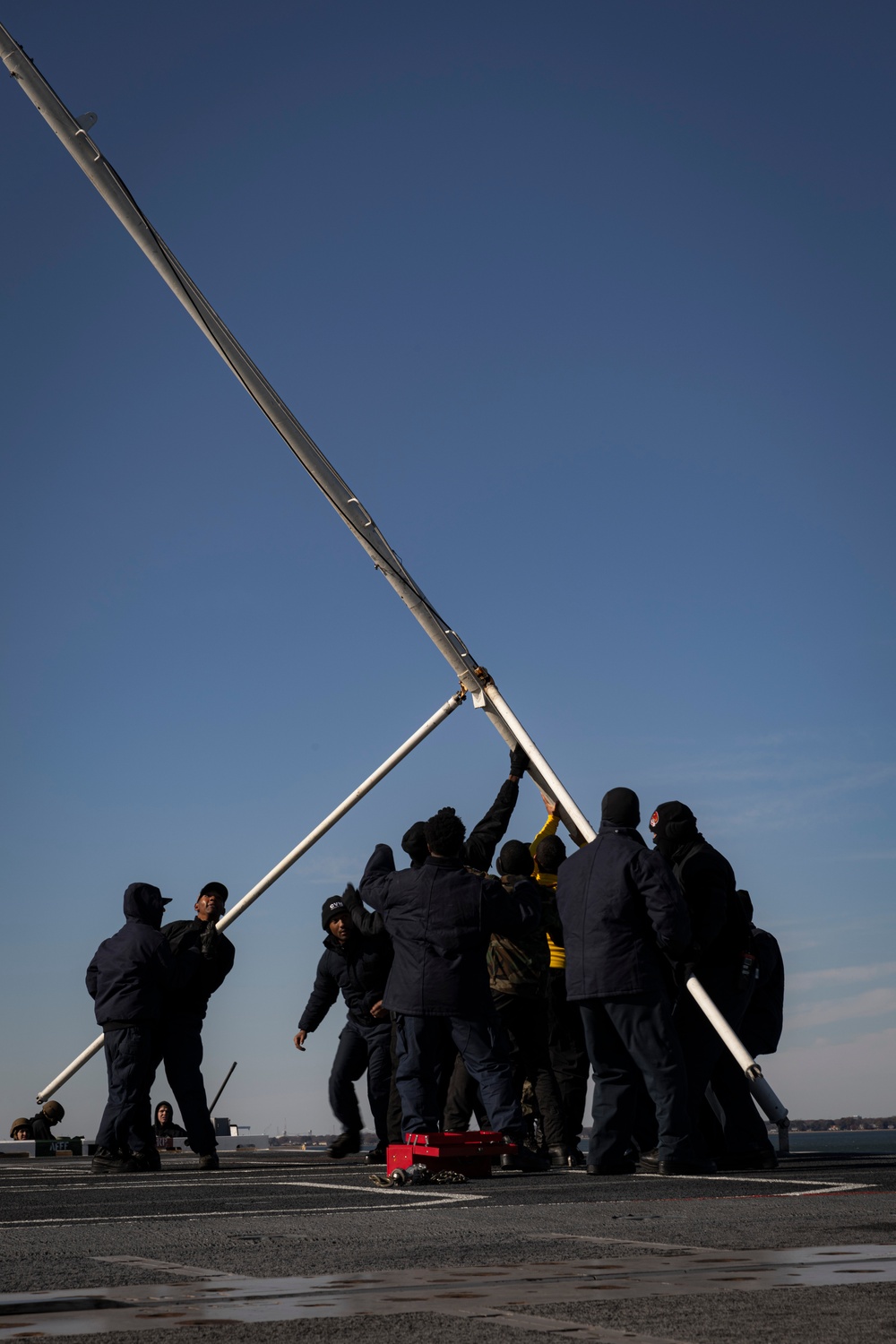 USS Gerald R. Ford (CVN 78) Sailors shift colors while underway