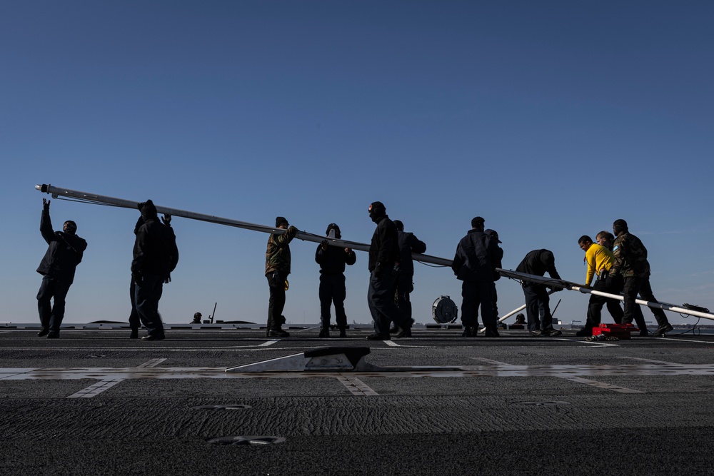 USS Gerald R. Ford (CVN 78) Sailors shift colors while underway