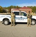 BDOC personnel pose in front of truck