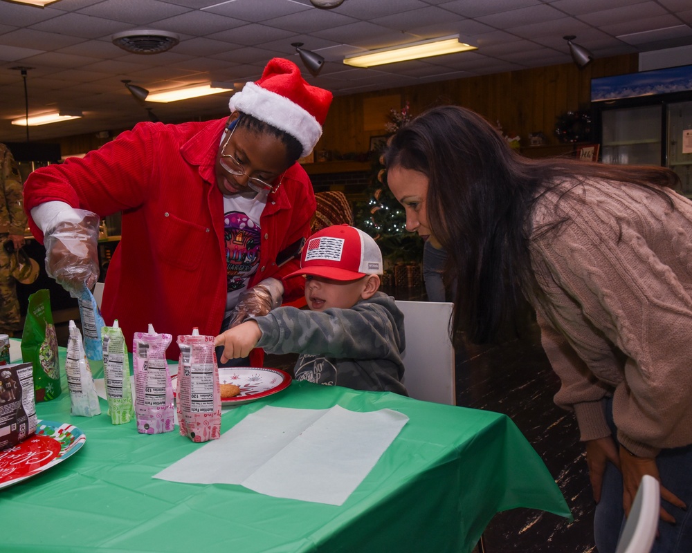 Members of the 117 ARW participate in holiday family event