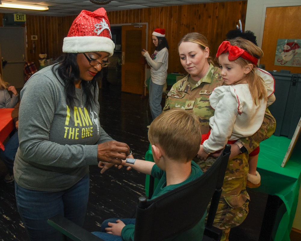 Members of the 117 ARW participate in holiday family event